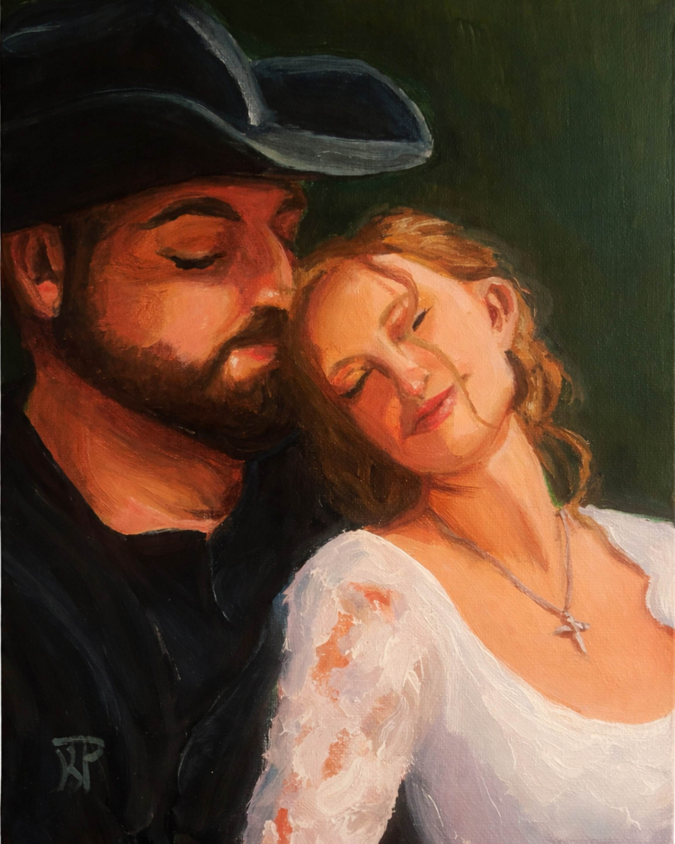 Portrait of a couple on their wedding day, bride and groom sitting together