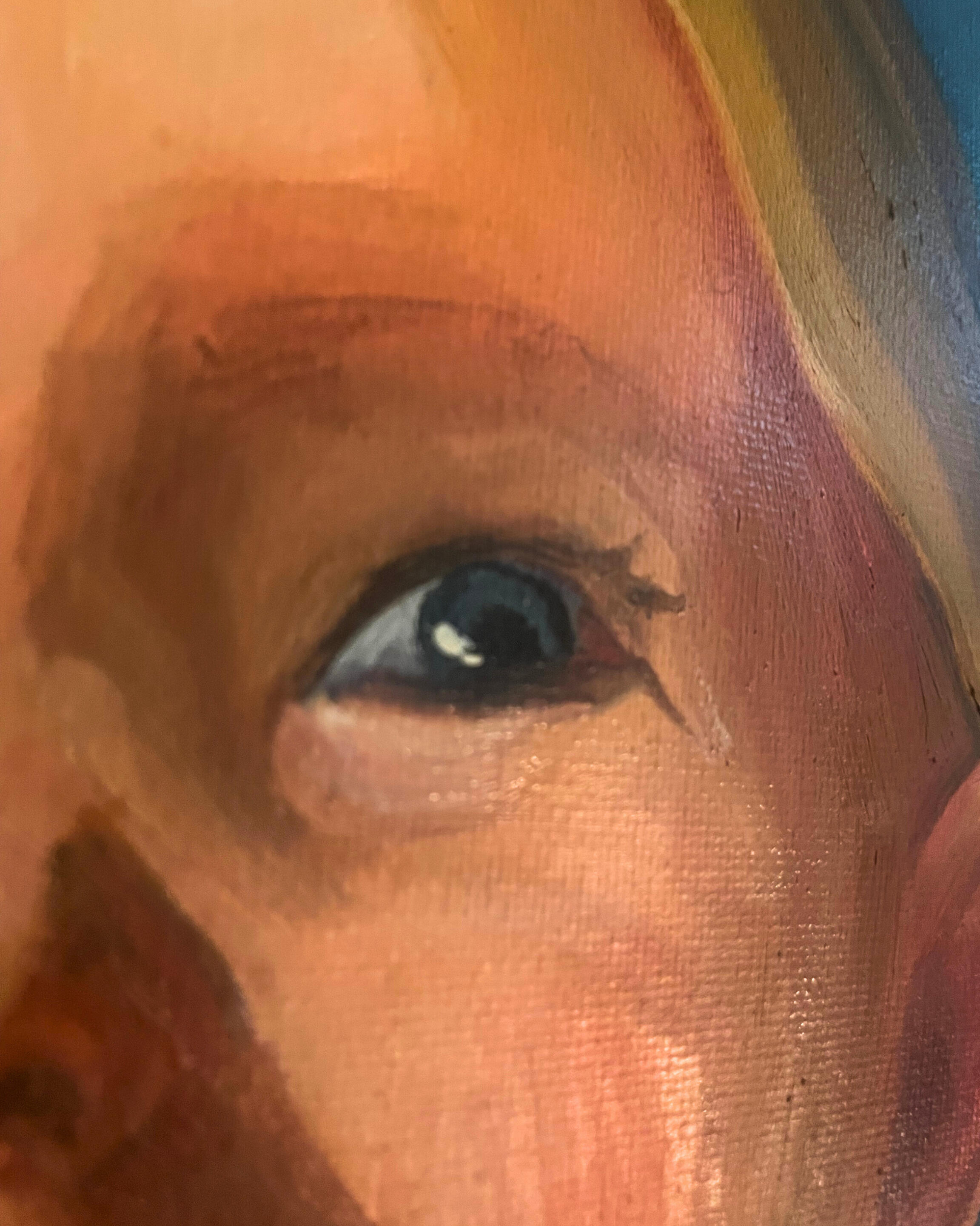 Close up detail photo of an oil portrait of a smiling baby girl's bue eye, showing canvas texture and fine brushwork